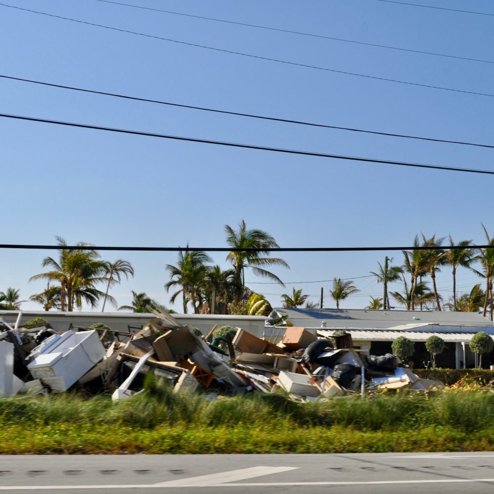 Piles of damaged property along the side of the highway after hurricane Irma.